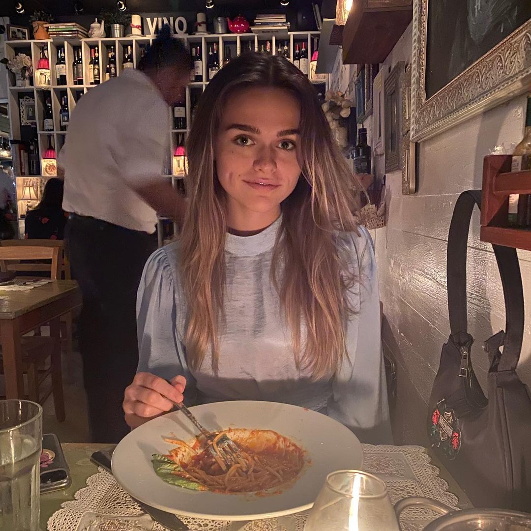 Megan Guthrie eating noodles in a restaurant