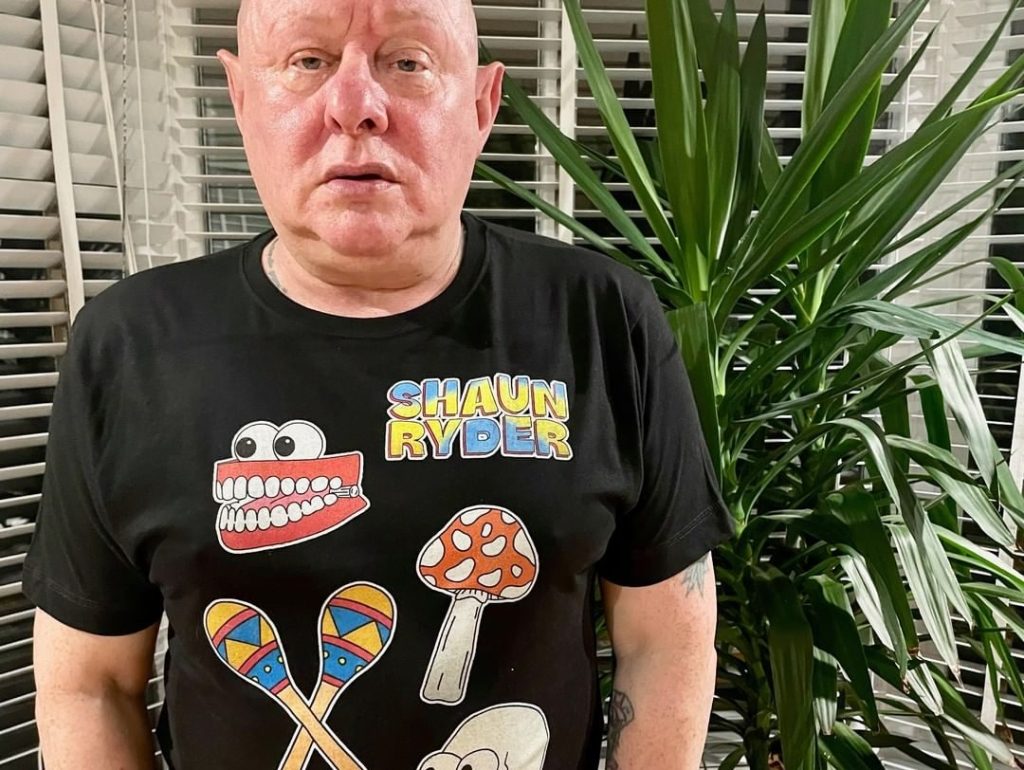 Shaun Ryder wearing a Mumbo Jumbo T-shirt