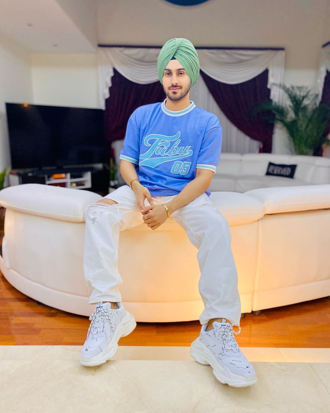 Rohanpreet Singh in green turban and blue t-shirt 