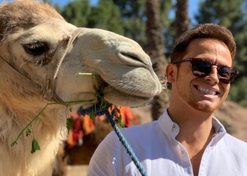 Joe Swash with a camel