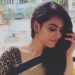 Pavithra Janani in open hair and Saree look