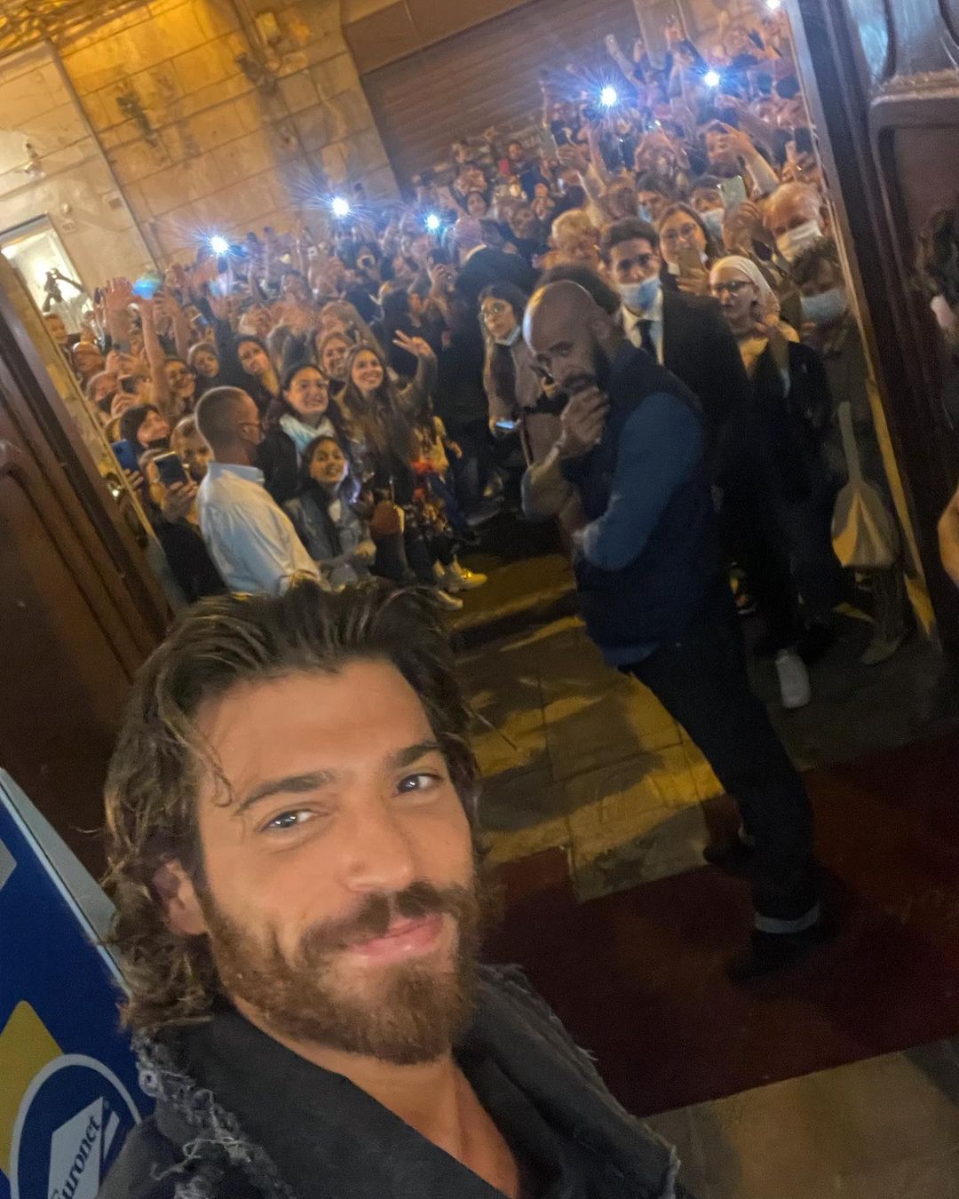 Can Yaman taking a selfie with his fans 