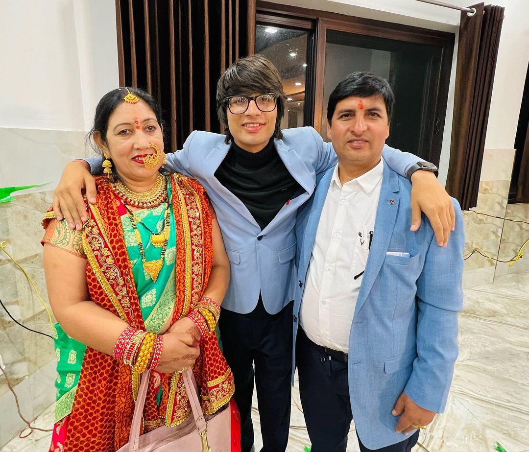 Sourav Joshi with his mother and father