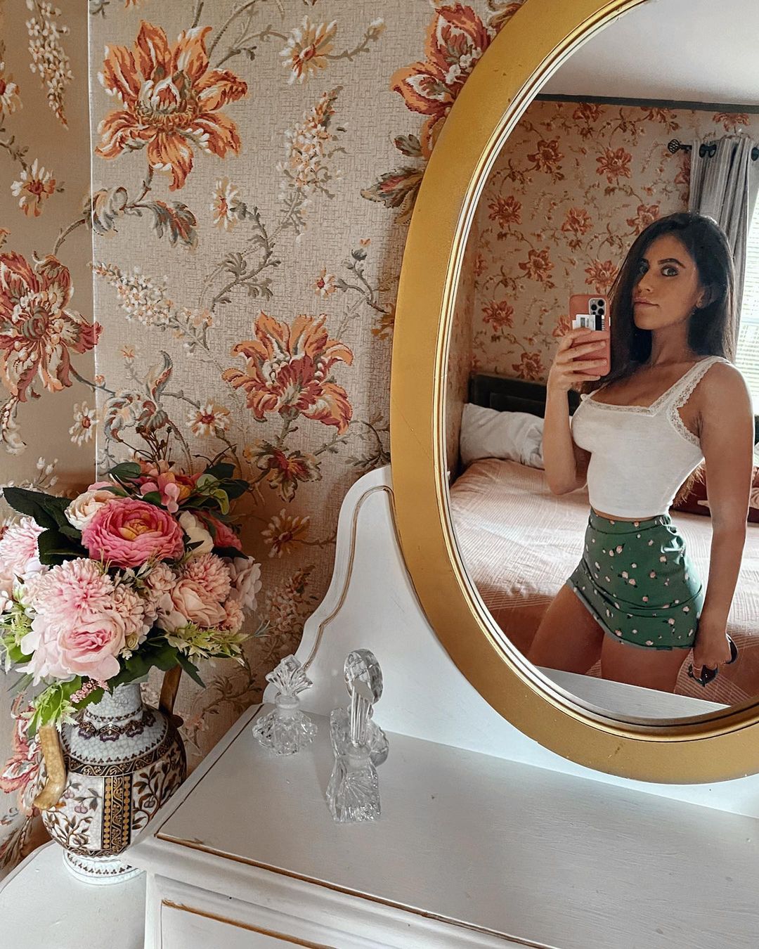 Violet Summers taking mirror selfie in a hot dress