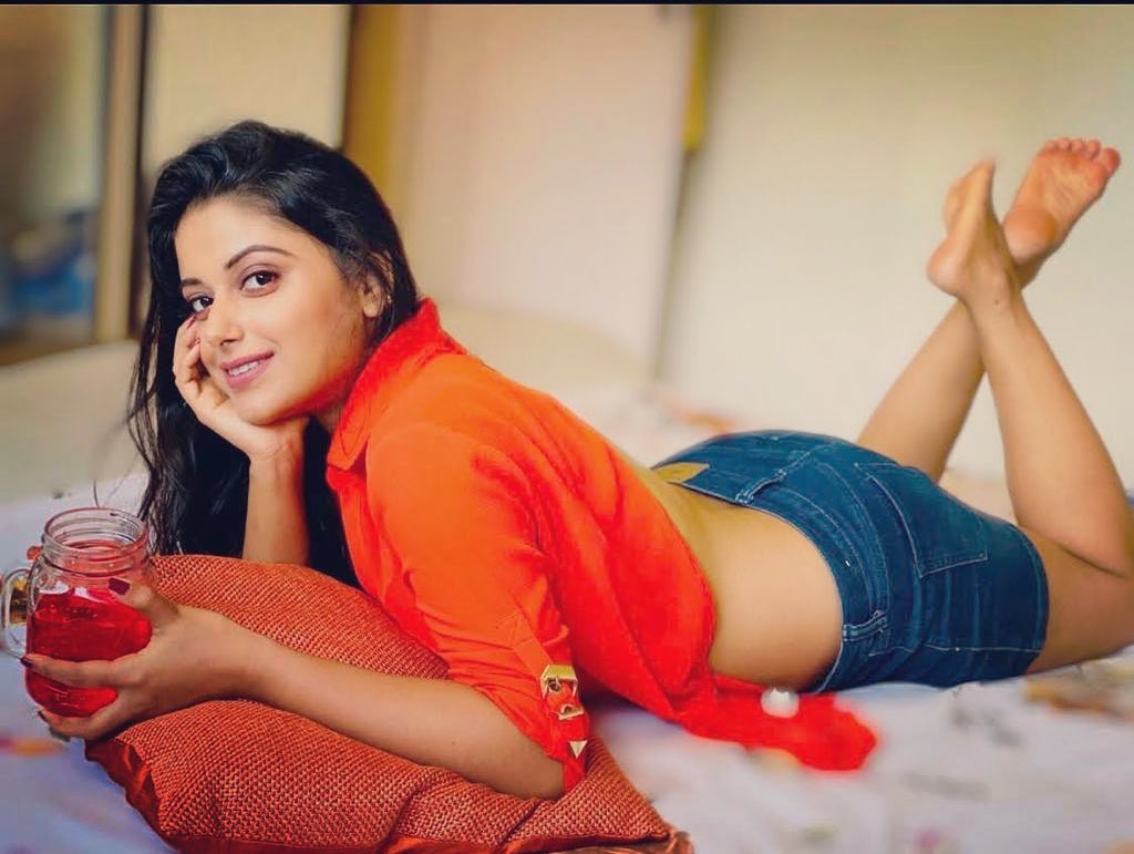 Charmsukh actress Sneha Paul in shorts and orange shirt