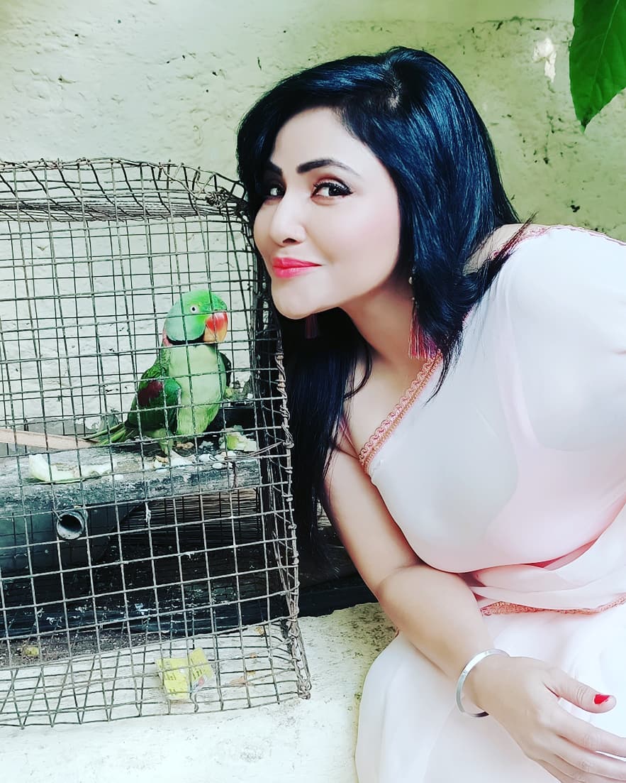 Rajsi Verma with a parrot 