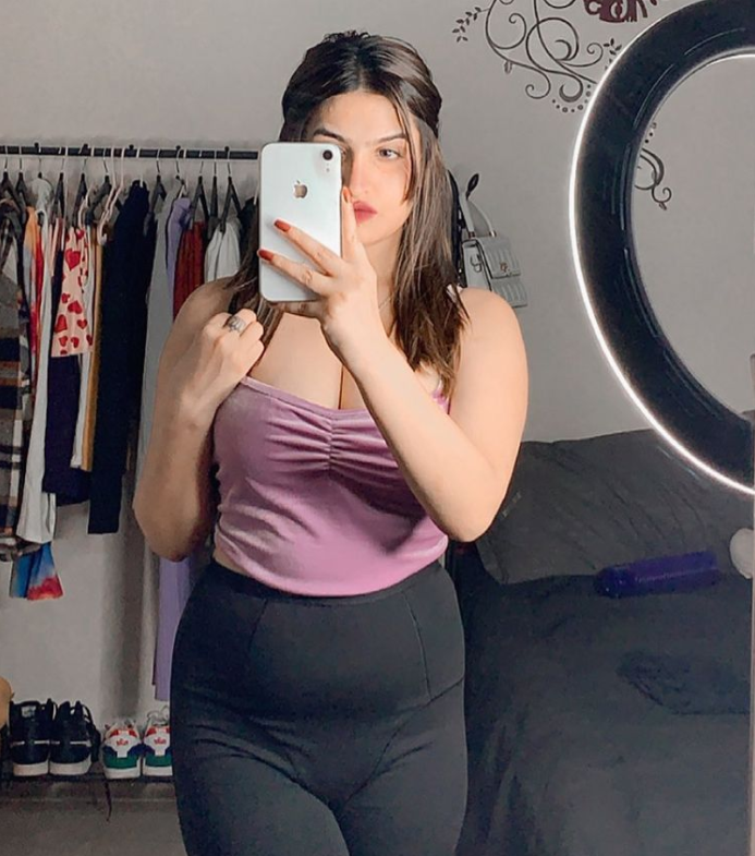 Sassy Poonam taking mirror selfie in hot dress