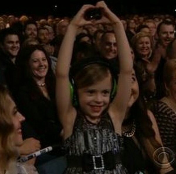 Harper Willow Grohl making heart symbol with both hands