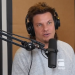 Theo von doing podcast in grey t-shirt