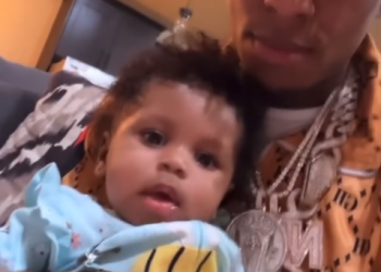 NBA YoungBoy holding his son Taylin Gaulden