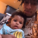 NBA YoungBoy holding his son Taylin Gaulden