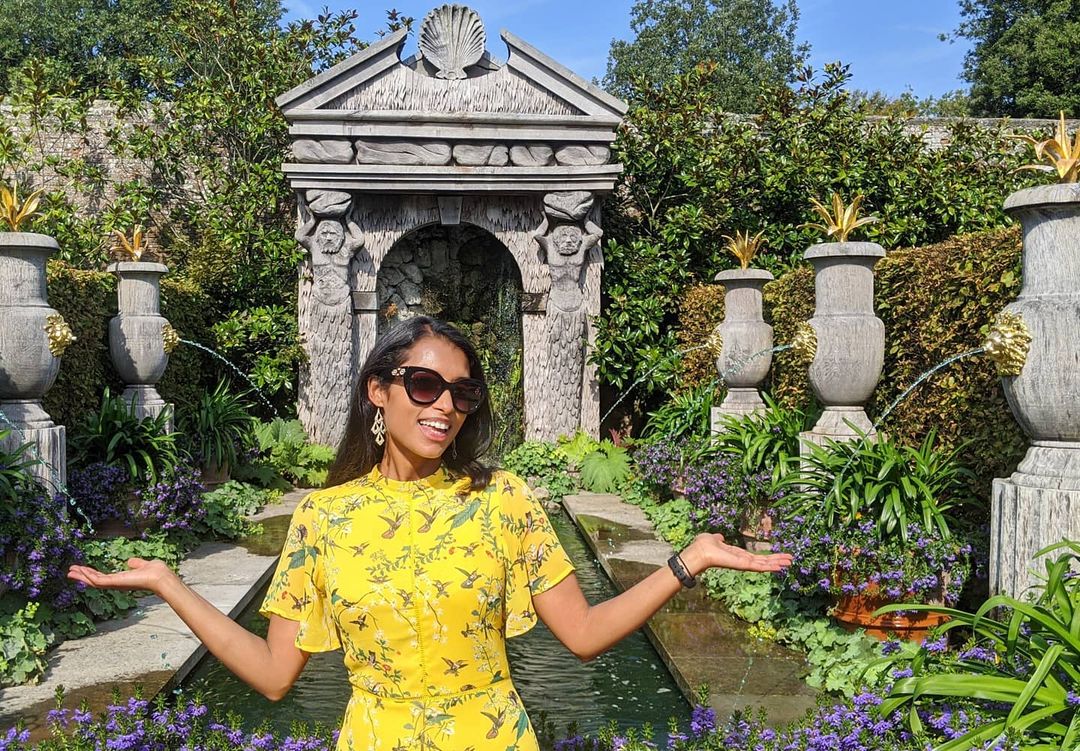 Luxmy Gopal in printed yellow dress enjoying at a garden 