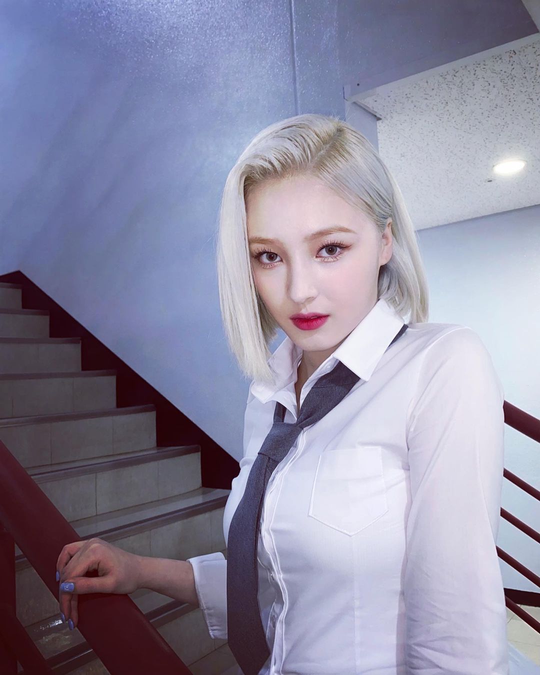 White haired Nancy Momoland in white shirt and black tie