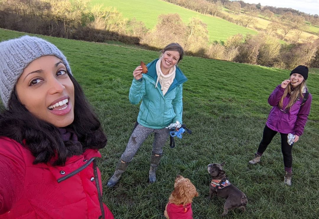 Luxmy Gopal enjoying with friends & dogs in a green area