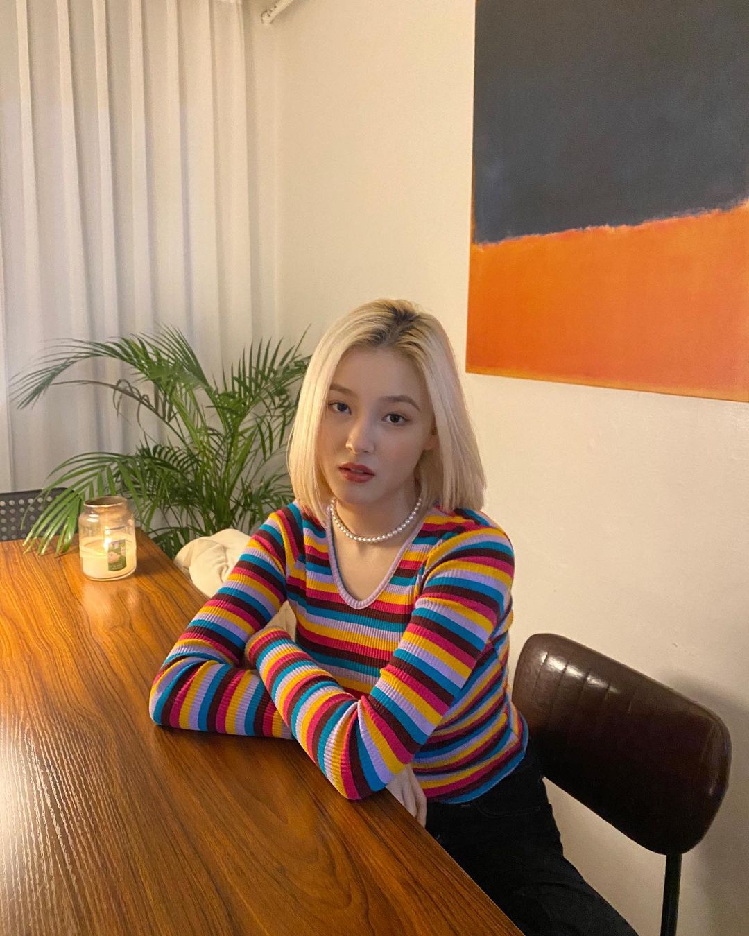 Nancy Momoland in stripped colorful top and black trouser