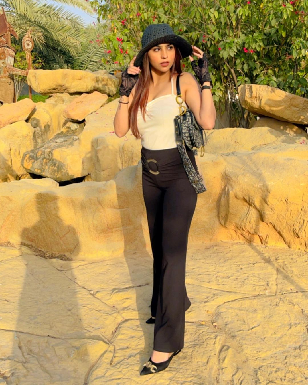 Pria Beniwal in white crop top and black trouser