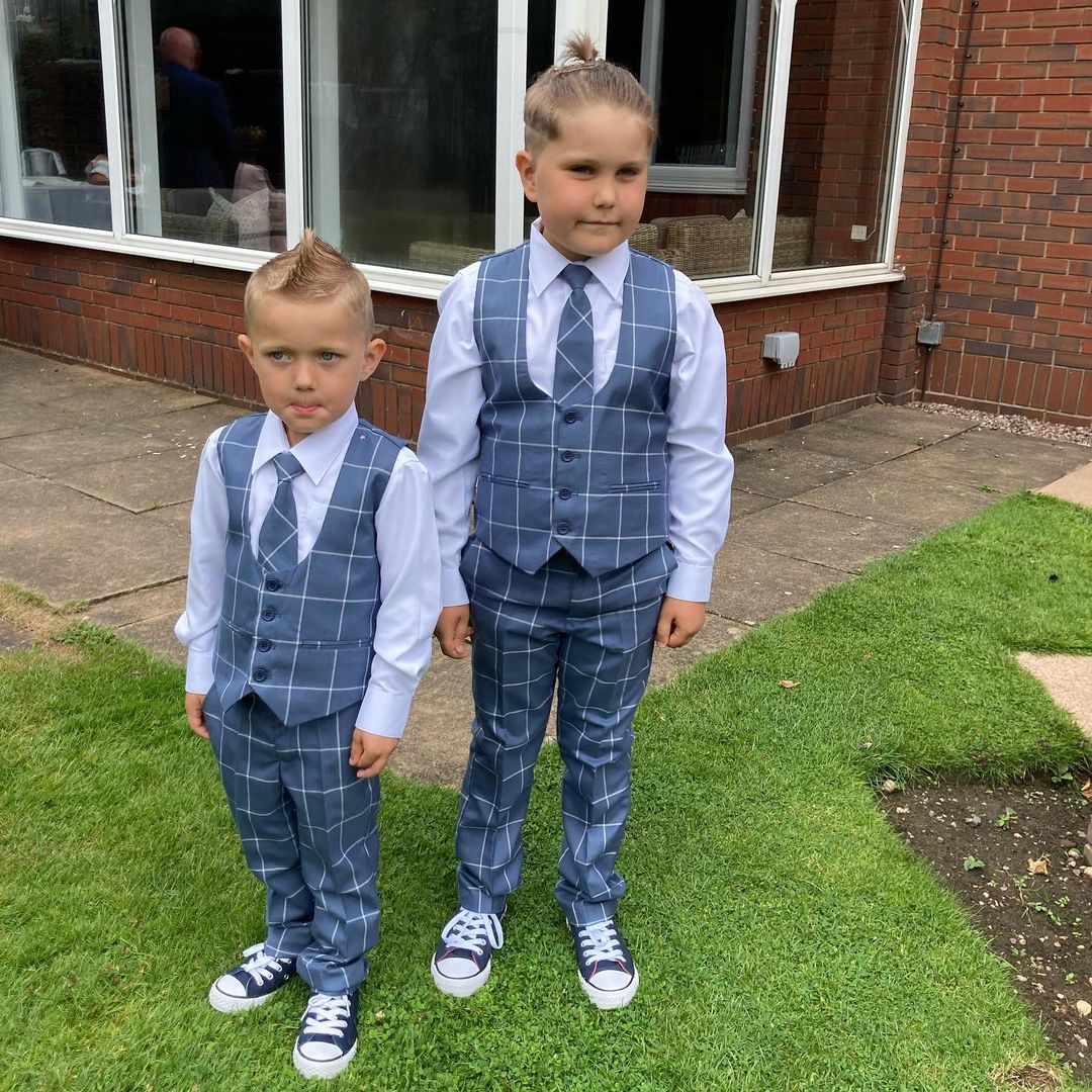 Michael Smith's two songs standing together in formal dress