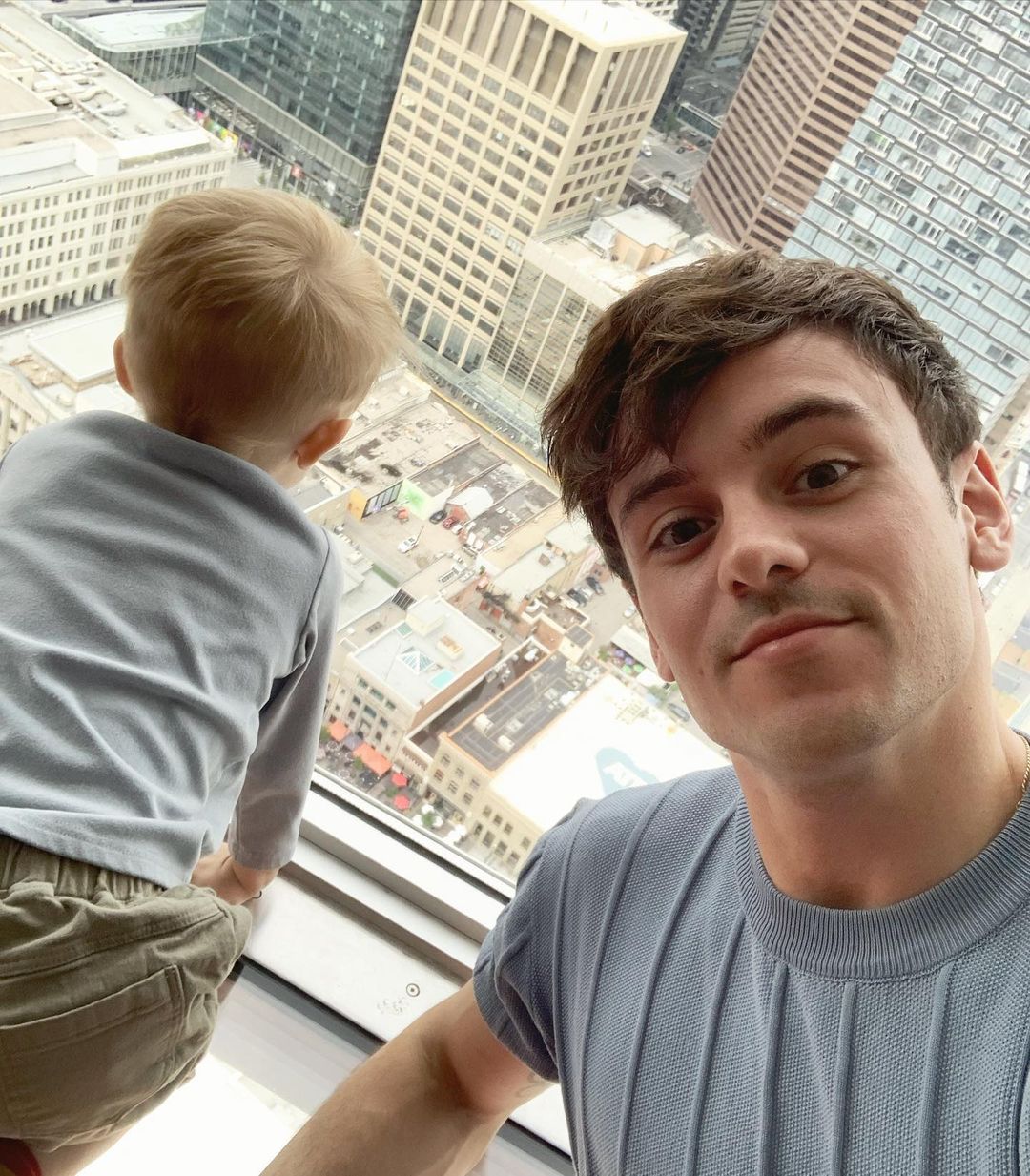 Tom Dalby with son at the top of a building