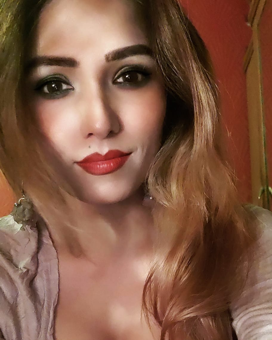 Zoya Rathore with open hair in light brown dress