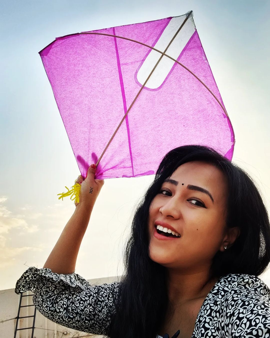 Anee Master with a pink kite in her hand