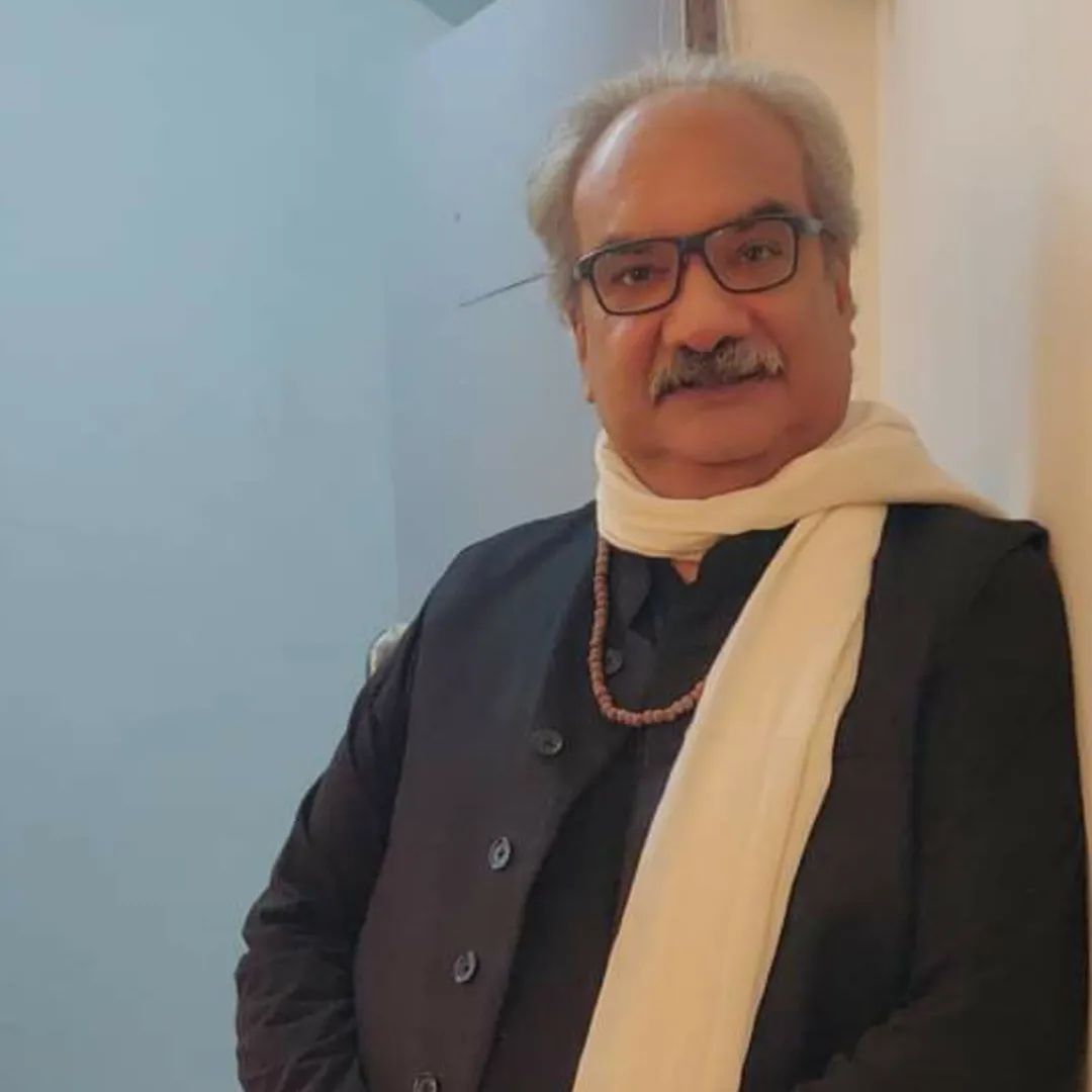 Babul Bhavesar in black coat and white muffler