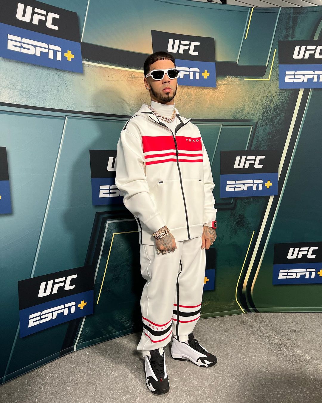 Anuel AA at a UFC event in white track suit