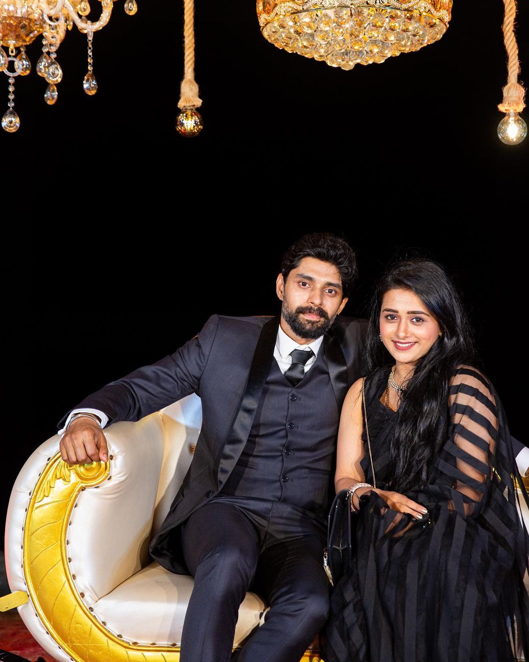 Radhika Muthukumar and Abhishek Iyer in black dress