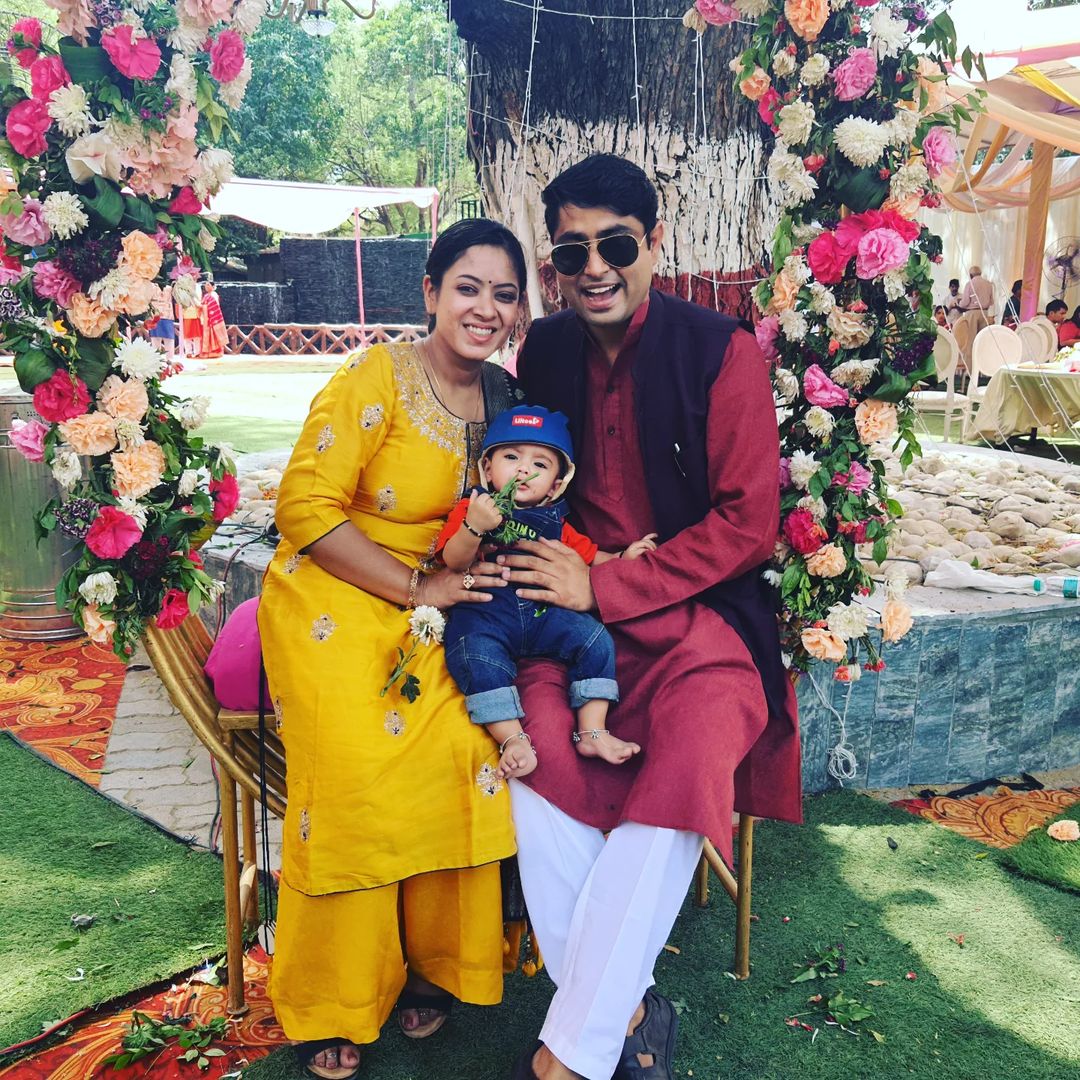 Tanu Jain with husband and child at a morning wedding 