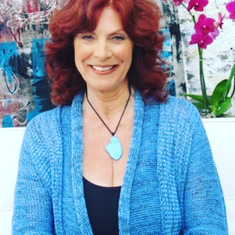 Kay Parker in blue top and brown hair