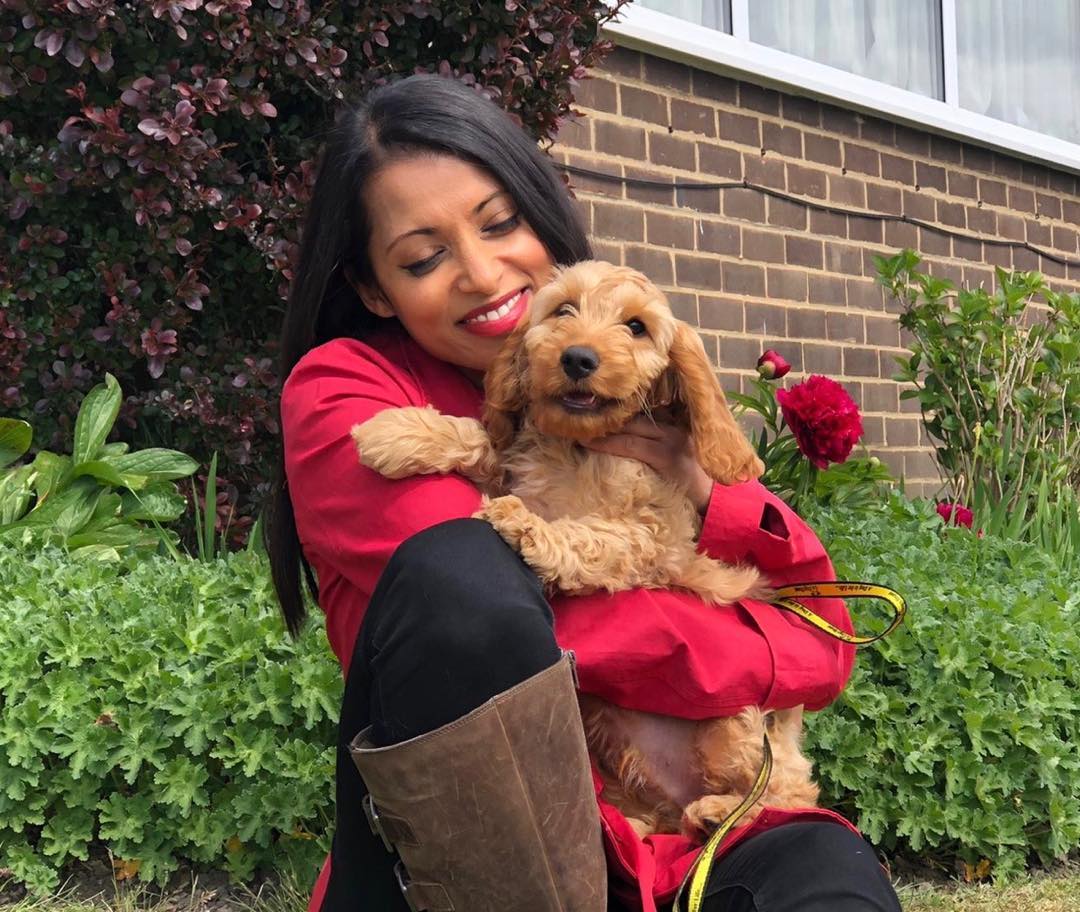 Luxmy Gopal in red dress with her pet dog