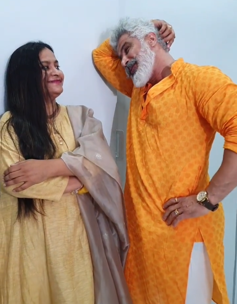 Rahul Jagtap in yellow kurta staring at his wife
