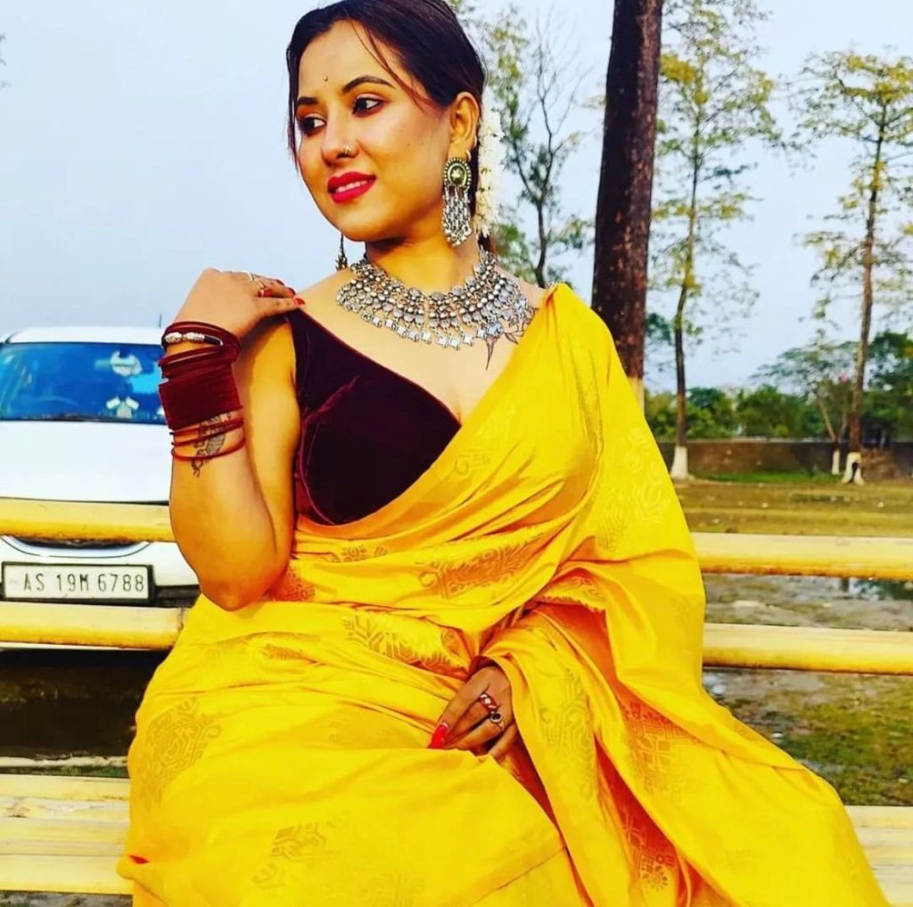 In a yellow saree