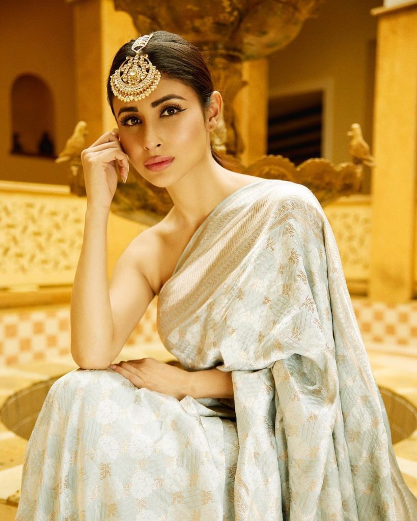 In a golden saree